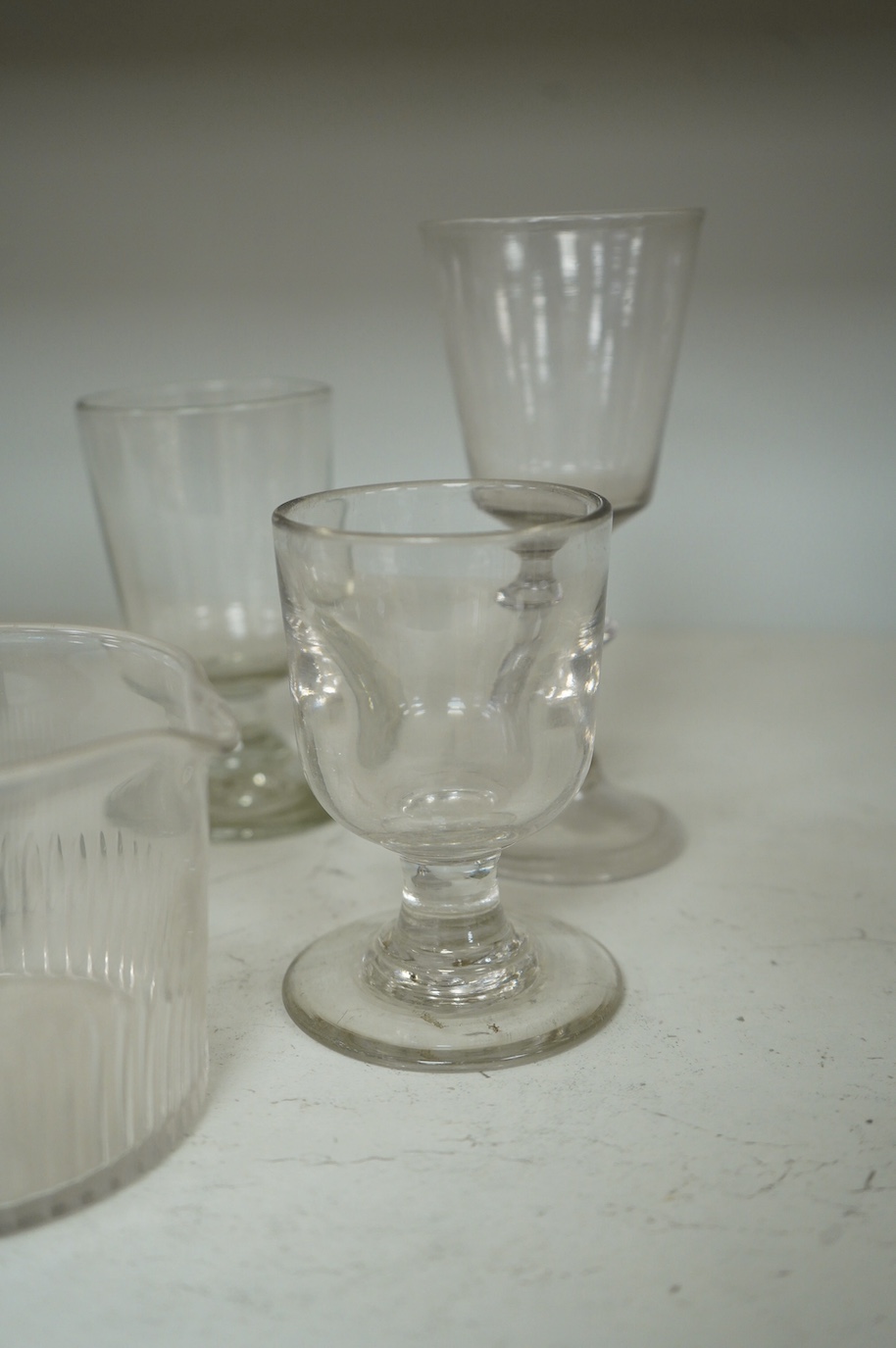 A collection of seven 18th century drinking glasses and a rinser. Condition - good